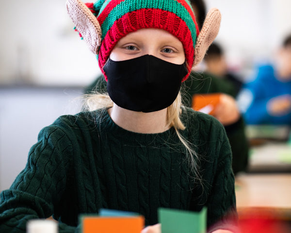 Highgate School Elf making a Christmas Card during the festive co-curricular day